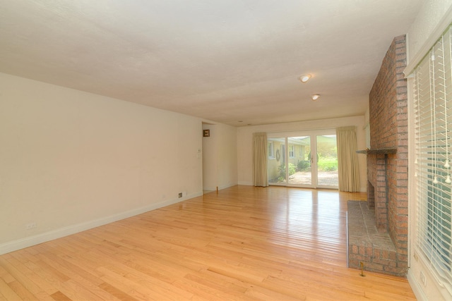 6N002 Laurel Dr, Medinah, IL 60157 - unfurnished living room with light wood-style flooring and baseboards