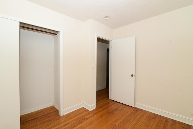 6N002 Laurel Dr, Medinah, IL 60157 - unfurnished bedroom with light wood-style floors, a closet, and baseboards