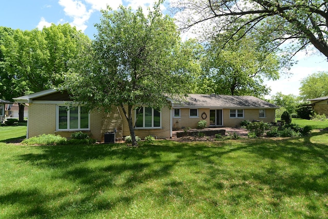 6N002 Laurel Dr, Medinah, IL 60157 - rear view of property featuring brick siding, central air condition unit, and a yard