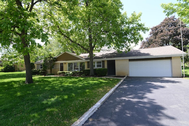 6N002 Laurel Dr, Medinah, IL 60157 - ranch-style home featuring asphalt driveway, an attached garage, brick siding, and a front lawn