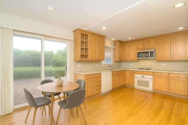 6N002 Laurel Dr, Medinah, IL 60157 - kitchen with white appliances, a sink, light countertops, light wood finished floors, and recessed lighting