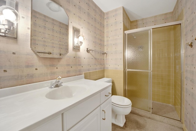 6033 N Sheridan Rd Unit 8E, Chicago, IL 60660 - bathroom with wallpapered walls, a stall shower, toilet, and vanity