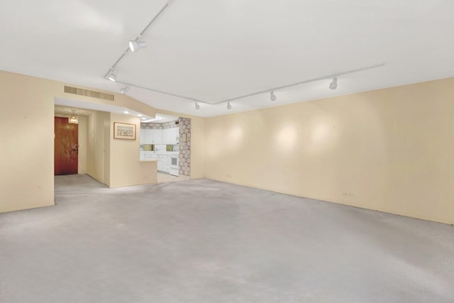 6033 N Sheridan Rd Unit 8E, Chicago, IL 60660 - basement featuring rail lighting and light colored carpet