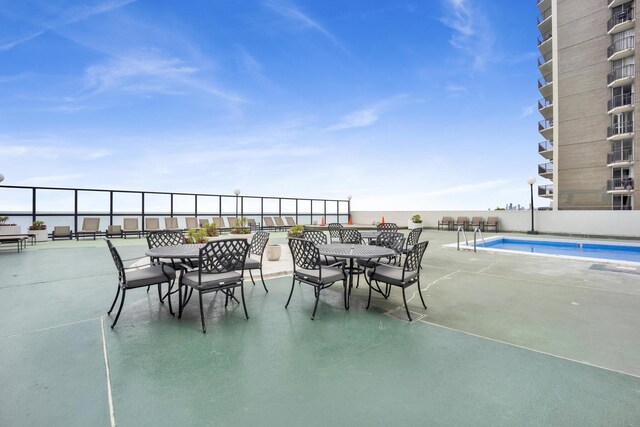 6033 N Sheridan Rd Unit 8E, Chicago, IL 60660 - view of patio / terrace with outdoor dining area and a community pool
