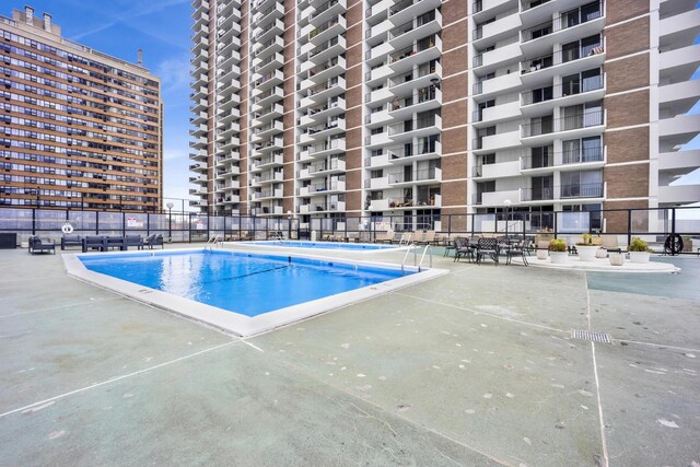 6033 N Sheridan Rd Unit 8E, Chicago, IL 60660 - community pool featuring a patio area