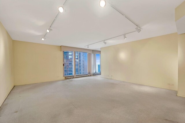6033 N Sheridan Rd Unit 8E, Chicago, IL 60660 - unfurnished room featuring track lighting and carpet flooring