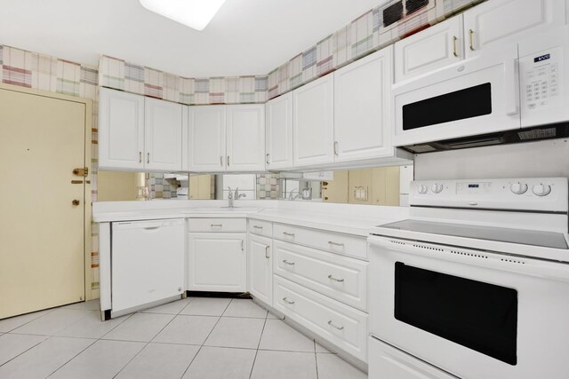 6033 N Sheridan Rd Unit 8E, Chicago, IL 60660 - kitchen with white appliances, light countertops, white cabinetry, and light tile patterned floors