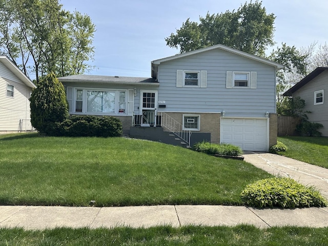 4251 190th Pl, Country Club Hills, IL 60478 - split level home featuring a garage, concrete driveway, brick siding, and a front yard