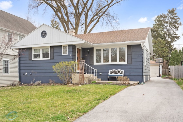 5317 Benton Ave, Downers Grove, IL 60515 - view of front of house with a chimney and a shingled roof