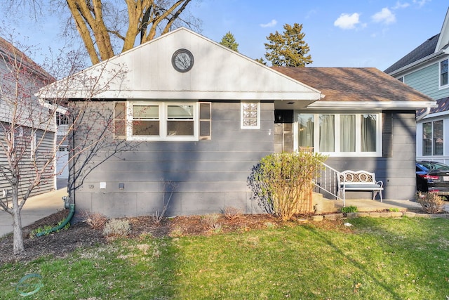 5317 Benton Ave, Downers Grove, IL 60515 - view of front of home with a front yard and a shingled roof