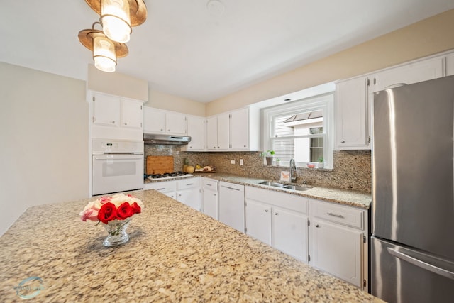 5317 Benton Ave, Downers Grove, IL 60515 - kitchen featuring white appliances, a sink, backsplash, under cabinet range hood, and white cabinetry