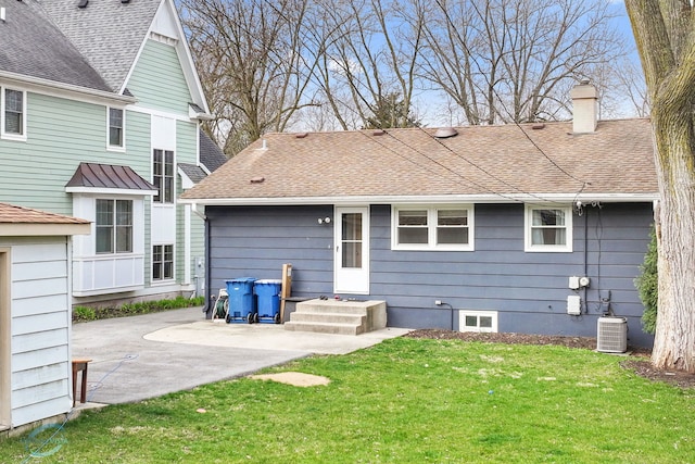 5317 Benton Ave, Downers Grove, IL 60515 - back of property with a chimney, a yard, a shingled roof, a patio, and central AC unit