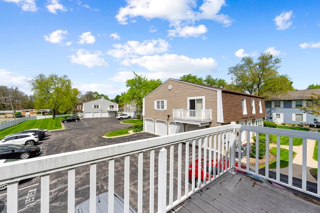 1585 Woodcutter Ln Unit D, Wheaton, IL 60189 - wooden deck featuring a residential view and a garage