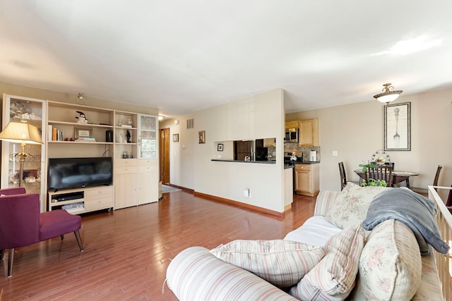 1585 Woodcutter Ln Unit D, Wheaton, IL 60189 - living room featuring wood finished floors and baseboards