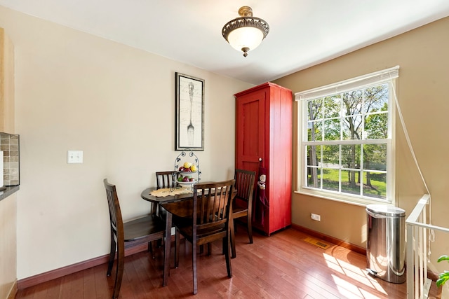 1585 Woodcutter Ln Unit D, Wheaton, IL 60189 - dining space with hardwood / wood-style floors and baseboards