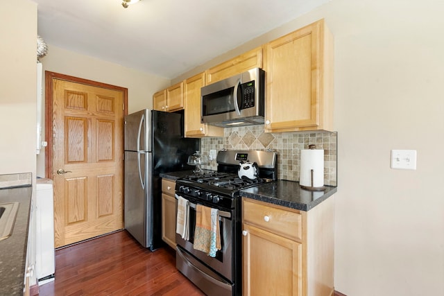 1585 Woodcutter Ln Unit D, Wheaton, IL 60189 - kitchen featuring appliances with stainless steel finishes, light brown cabinets, dark wood-style floors, and dark countertops