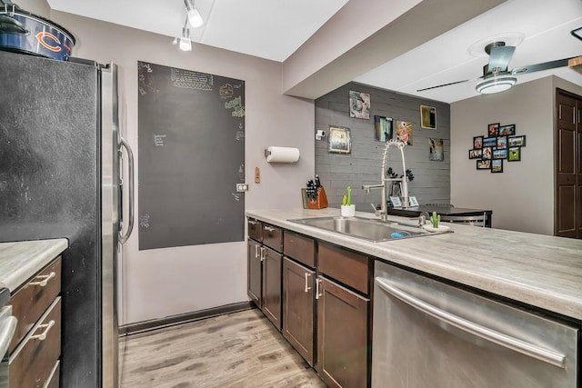 14028 Laramie Ave Unit 1719, Crestwood, IL 60418 - kitchen featuring stainless steel appliances, a sink, light wood-style floors, light countertops, and ceiling fan