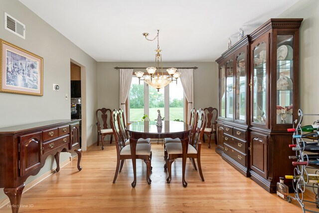 13836 W Joliet Rd, Manhattan, IL 60442 - dining space featuring a chandelier and light wood-type flooring