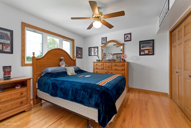 13836 W Joliet Rd, Manhattan, IL 60442 - bedroom featuring light wood-type flooring, baseboards, a ceiling fan, and a closet