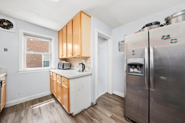9141 S Albany Ave S, Evergreen Park, IL 60805 - kitchen with stainless steel fridge with ice dispenser, light wood-type flooring, baseboards, light countertops, and backsplash