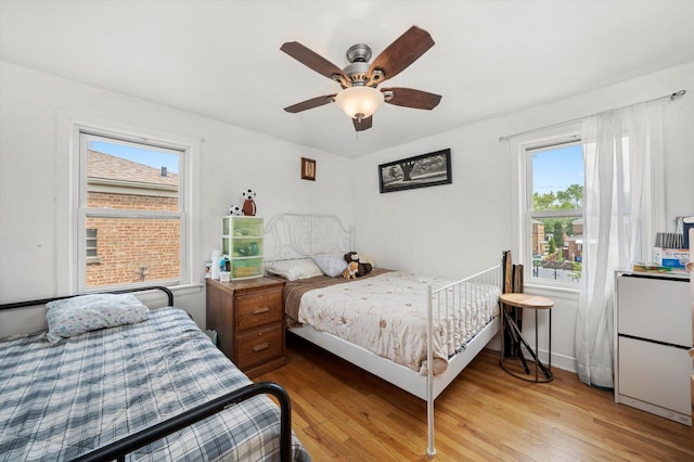 9141 S Albany Ave S, Evergreen Park, IL 60805 - bedroom with light wood-type flooring, a ceiling fan, and baseboards