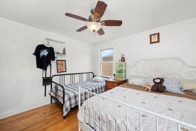 9141 S Albany Ave S, Evergreen Park, IL 60805 - bedroom with light wood-style floors, a ceiling fan, and baseboards