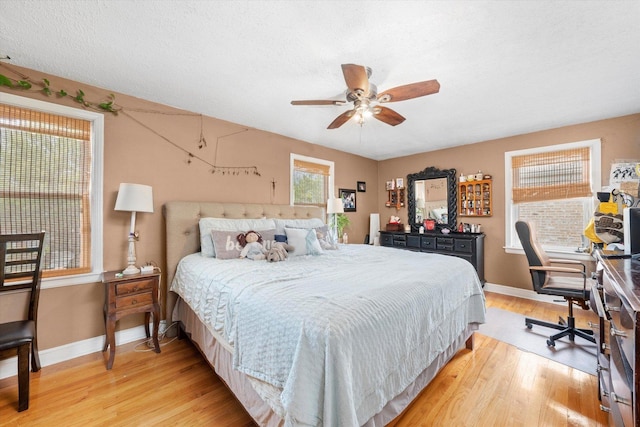 9141 S Albany Ave S, Evergreen Park, IL 60805 - bedroom featuring baseboards, light wood-style flooring, an office area, and a ceiling fan