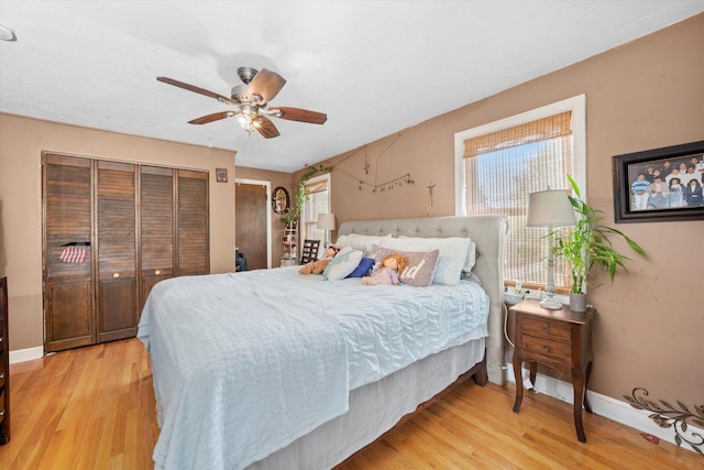 9141 S Albany Ave S, Evergreen Park, IL 60805 - bedroom with light wood finished floors, baseboards, and ceiling fan