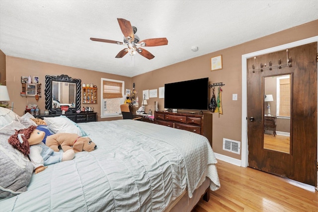 9141 S Albany Ave S, Evergreen Park, IL 60805 - bedroom with wood finished floors, baseboards, and a ceiling fan