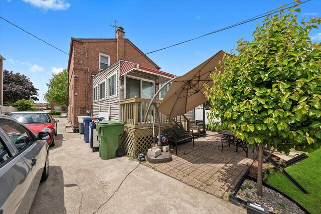 9141 S Albany Ave S, Evergreen Park, IL 60805 - back of house featuring brick siding and a chimney