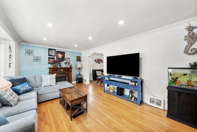 9141 S Albany Ave S, Evergreen Park, IL 60805 - living area featuring arched walkways, ornamental molding, recessed lighting, light wood-style floors, and baseboards