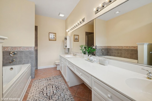 3721 N Sheffield Ave Unit B2, Chicago, IL 60613 - bathroom with tile patterned floors, double vanity, toilet, and a bath