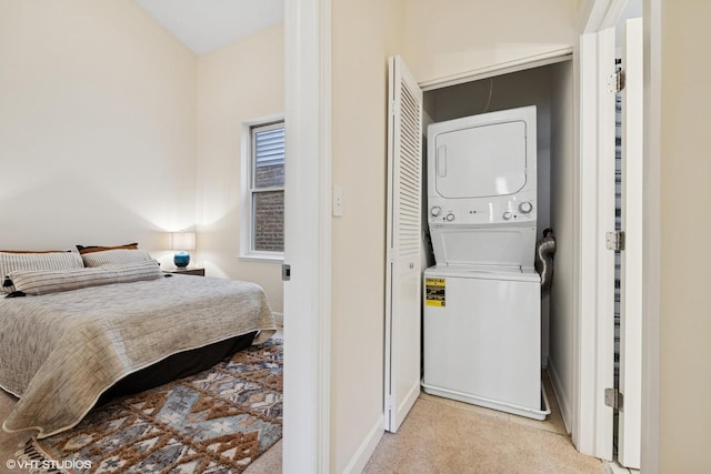 3721 N Sheffield Ave Unit B2, Chicago, IL 60613 - laundry room with estacked washer and dryer, carpet floors, and baseboards