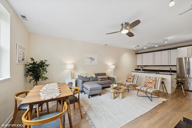 3721 N Sheffield Ave Unit B2, Chicago, IL 60613 - living area with a ceiling fan, light wood-style floors, and baseboards