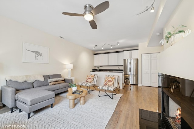 3721 N Sheffield Ave Unit B2, Chicago, IL 60613 - living room featuring a ceiling fan and light wood-style floors