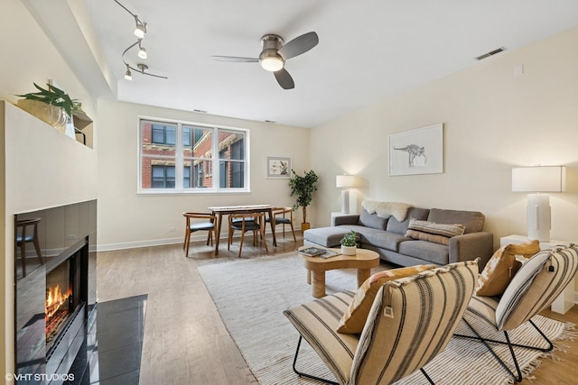 3721 N Sheffield Ave Unit B2, Chicago, IL 60613 - living room with ceiling fan, wood finished floors, rail lighting, and baseboards