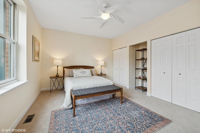 3721 N Sheffield Ave Unit B2, Chicago, IL 60613 - carpeted bedroom featuring two closets, baseboards, and a ceiling fan