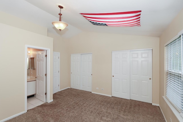 1379 Grandview Ct, Algonquin, IL 60102 - unfurnished bedroom featuring multiple closets, carpet, lofted ceiling, ensuite bath, and baseboards