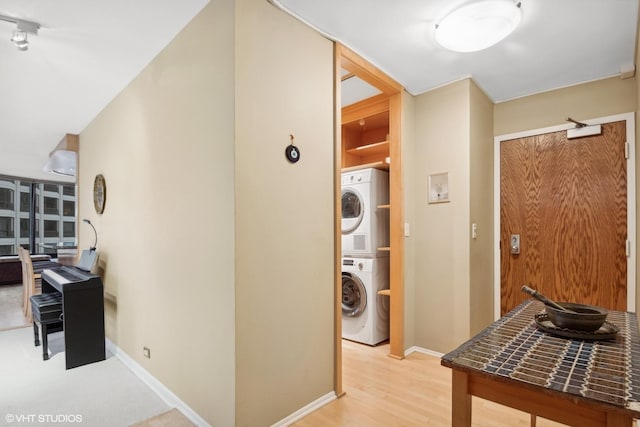 155 N Harbor Dr Unit 1103, Chicago, IL 60601 - corridor with stacked washer and clothes dryer, baseboards, and light wood-style flooring