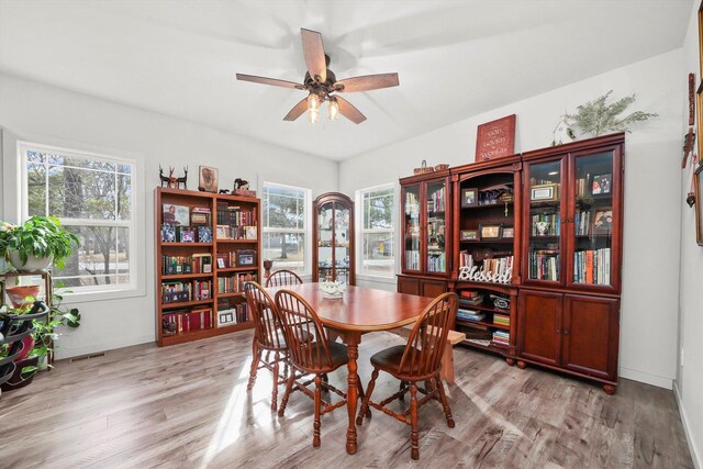 6010 Peart Rd, Morris, IL 60450 - dining room with light wood-type flooring, a ceiling fan, and baseboards