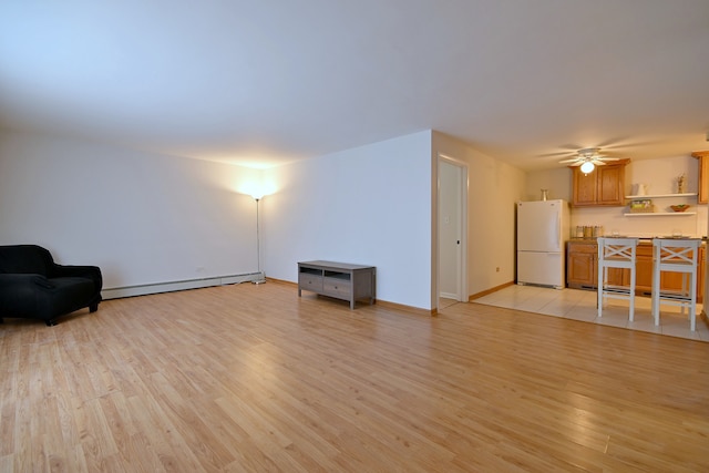 5816 N Nagle Ave Unit B, Chicago, IL 60646 - living room with light wood finished floors, baseboard heating, a ceiling fan, and baseboards