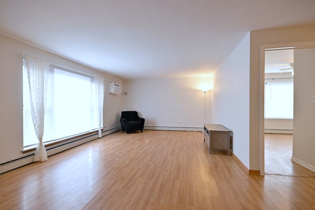 5816 N Nagle Ave Unit B, Chicago, IL 60646 - unfurnished room featuring baseboard heating, light wood finished floors, an AC wall unit, and a baseboard heating unit