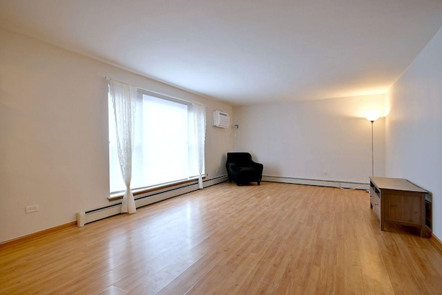 5816 N Nagle Ave Unit B, Chicago, IL 60646 - unfurnished room featuring a baseboard heating unit, baseboard heating, light wood-style flooring, and a wall mounted AC