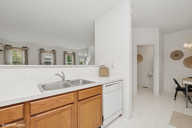 707 Morris Ct, Lakemoor, IL 60051 - kitchen featuring dishwasher, a sink, light floors, light countertops, and a chandelier