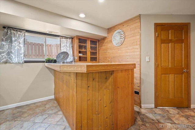 6416 W Rawson Bridge Rd W, Cary, IL 60013 - indoor dry bar featuring stone finish floors and baseboards