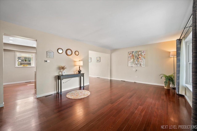 6416 W Rawson Bridge Rd W, Cary, IL 60013 - unfurnished living room featuring hardwood / wood-style flooring and baseboards