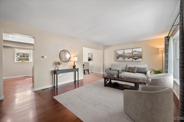 6416 W Rawson Bridge Rd W, Cary, IL 60013 - living area with baseboards and dark wood-style floors