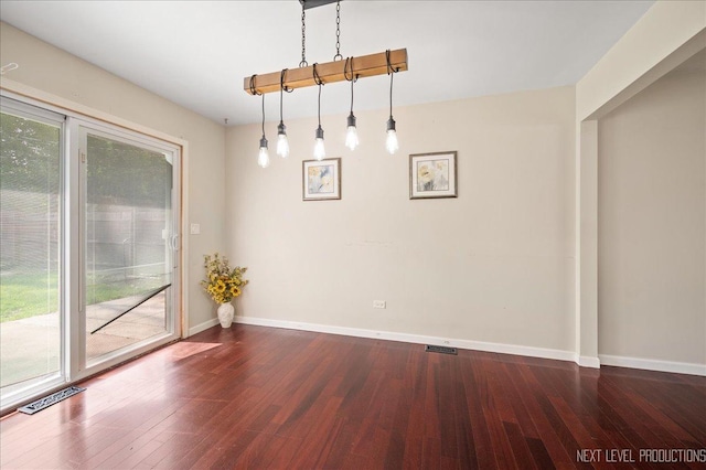 6416 W Rawson Bridge Rd W, Cary, IL 60013 - unfurnished dining area featuring dark wood-style flooring and baseboards