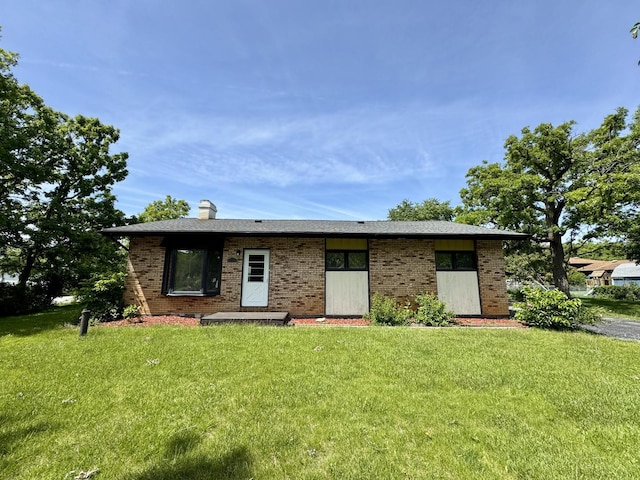 16159 Long Ave, Oak Forest, IL 60452 - view of front facade featuring brick siding, a front yard, and a chimney