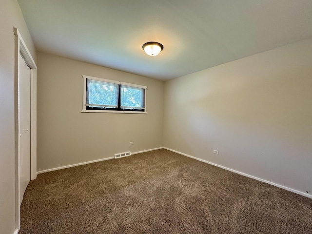 16159 Long Ave, Oak Forest, IL 60452 - unfurnished bedroom with dark colored carpet, baseboards, and a closet